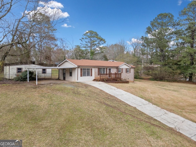 ranch-style house featuring a carport, concrete driveway, a front lawn, and brick siding