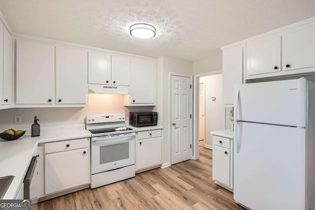 kitchen featuring white appliances, under cabinet range hood, white cabinetry, and light countertops