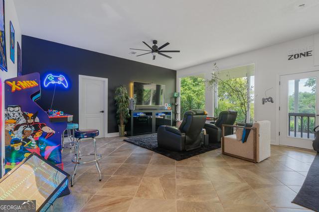 living room with ceiling fan