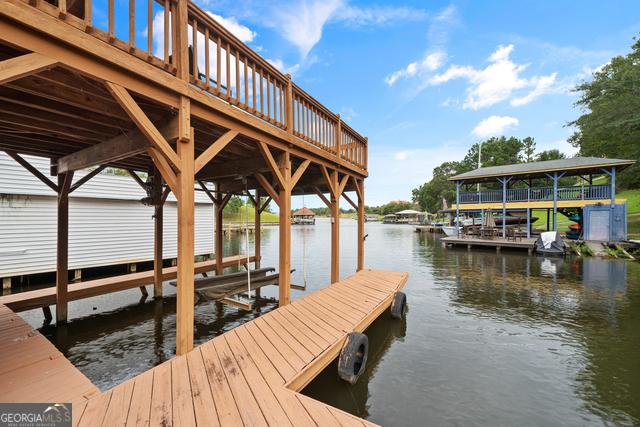 view of dock with a water view and boat lift