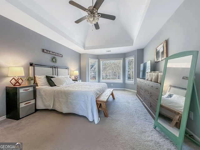 bedroom with lofted ceiling, ceiling fan, carpet flooring, and baseboards