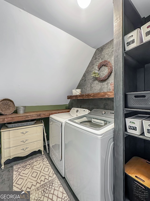 clothes washing area with laundry area and washer and dryer