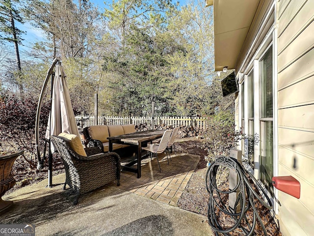 view of patio / terrace with outdoor dining space and a fenced backyard