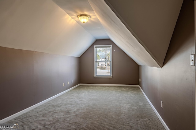 bonus room featuring carpet floors, lofted ceiling, and baseboards