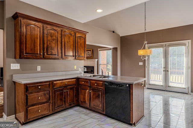 kitchen with marble finish floor, light countertops, a sink, dishwasher, and a peninsula