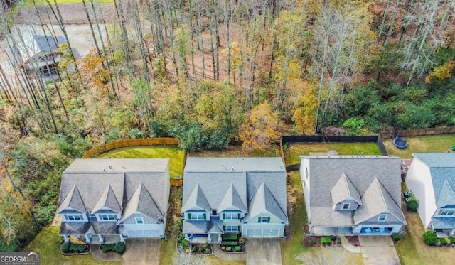 birds eye view of property with a residential view and a view of trees