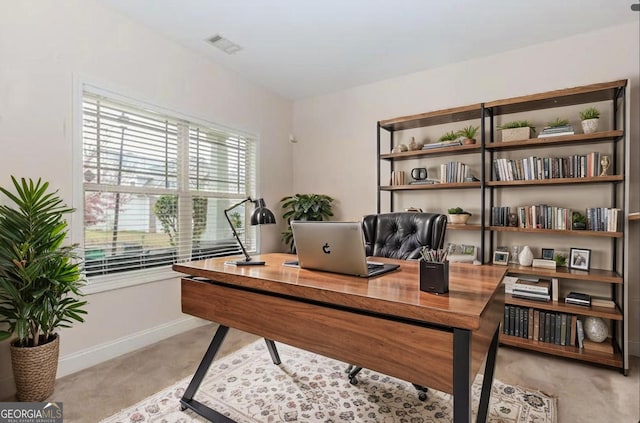 office space featuring visible vents and baseboards