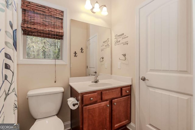 full bathroom with vanity and toilet