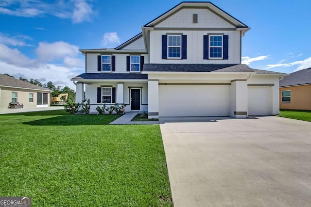 view of front facade with an attached garage, driveway, a front lawn, and roof with shingles