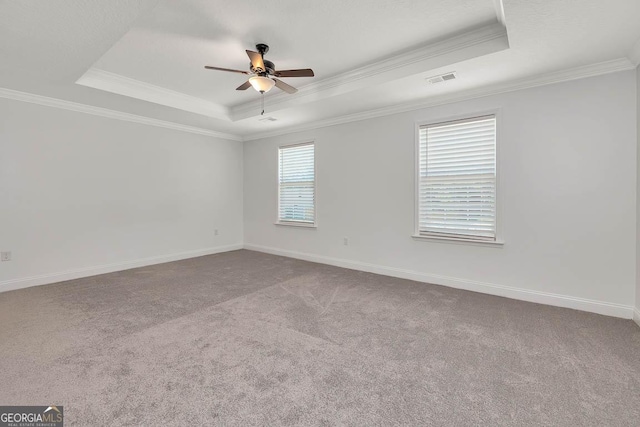 137 Walnut Way, Kingsland, GA 31548 - spare room featuring a raised ceiling, carpet flooring, crown molding, a ceiling fan, and baseboards