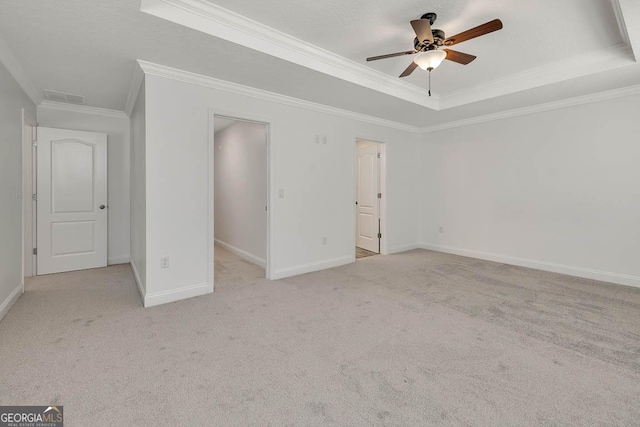 137 Walnut Way, Kingsland, GA 31548 - empty room featuring a raised ceiling, crown molding, a ceiling fan, carpet, and baseboards