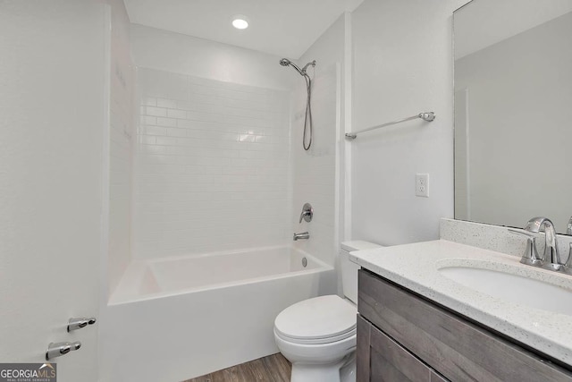137 Walnut Way, Kingsland, GA 31548 - bathroom featuring toilet, vanity,  shower combination, and wood finished floors