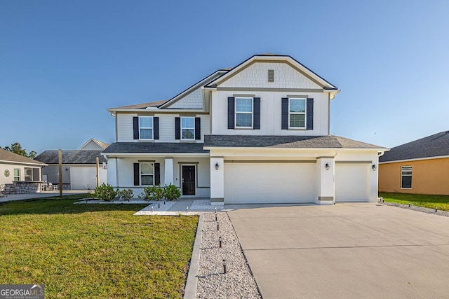 137 Walnut Way, Kingsland, GA 31548 - view of front facade with concrete driveway, a garage, a front yard, and a shingled roof