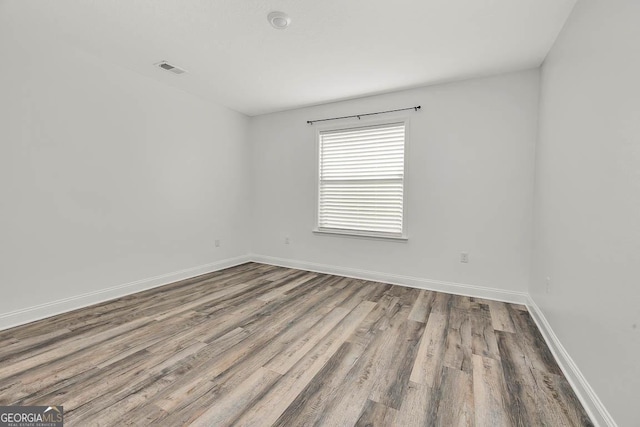 137 Walnut Way, Kingsland, GA 31548 - empty room featuring wood finished floors and baseboards