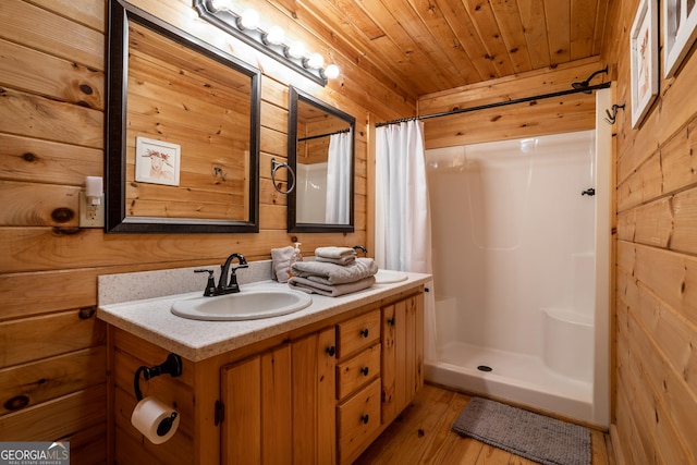 bathroom featuring a stall shower, wood finished floors, wooden walls, and wood ceiling