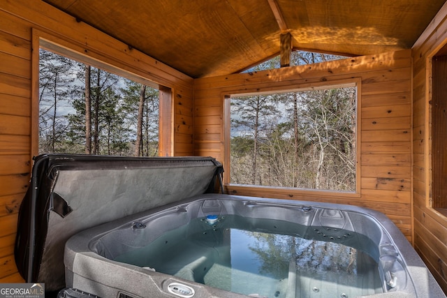 exterior space with a hot tub