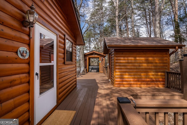 wooden deck with an outbuilding