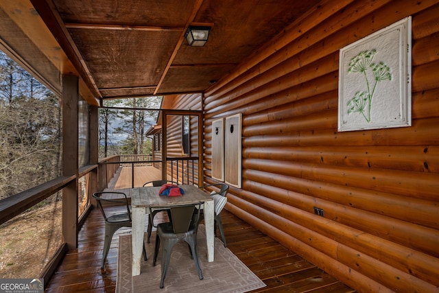 exterior space with outdoor dining area and a deck