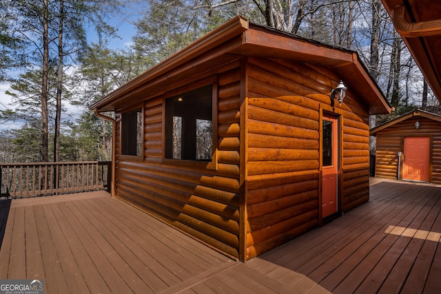 wooden deck with an outdoor structure