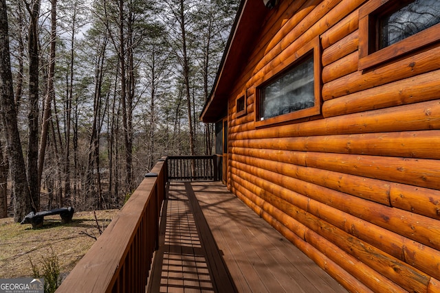 view of side of home with faux log siding