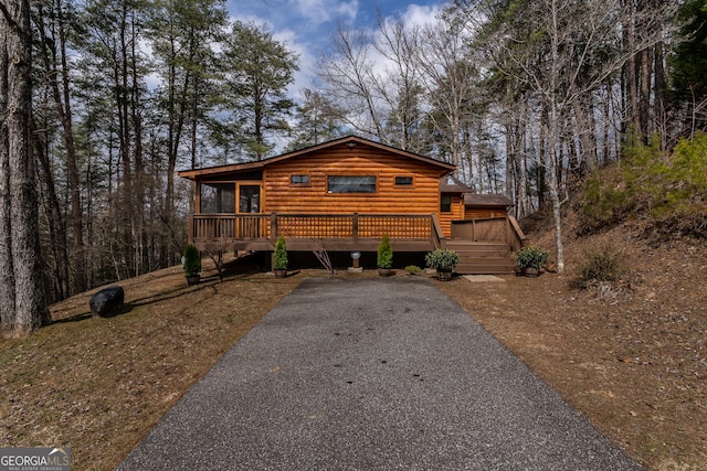 view of front of house with a wooden deck