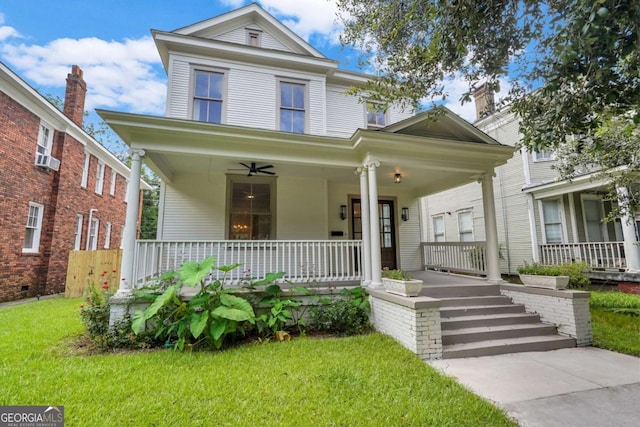 815 E Henry St, Savannah, GA 31401 - view of front facade with covered porch, a front yard, and ceiling fan