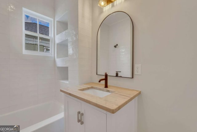 bathroom with tub / shower combination and vanity