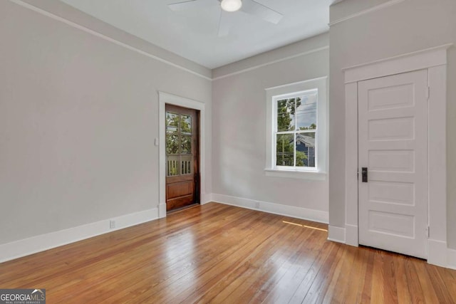 entrance foyer with ceiling fan, light wood-type flooring, and baseboards