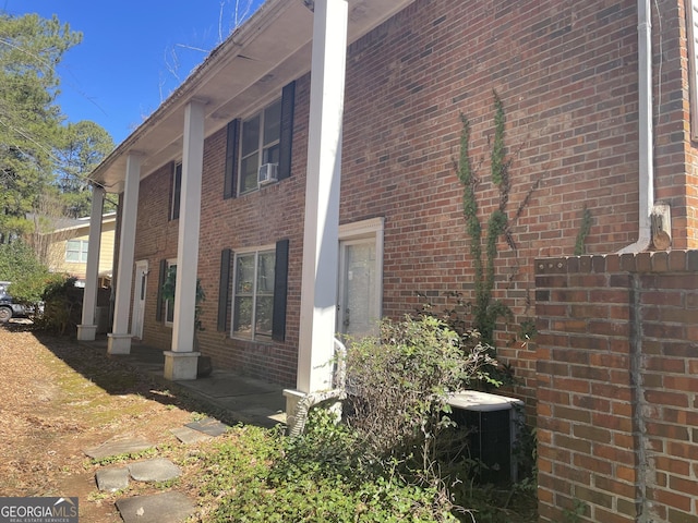 view of side of property with brick siding