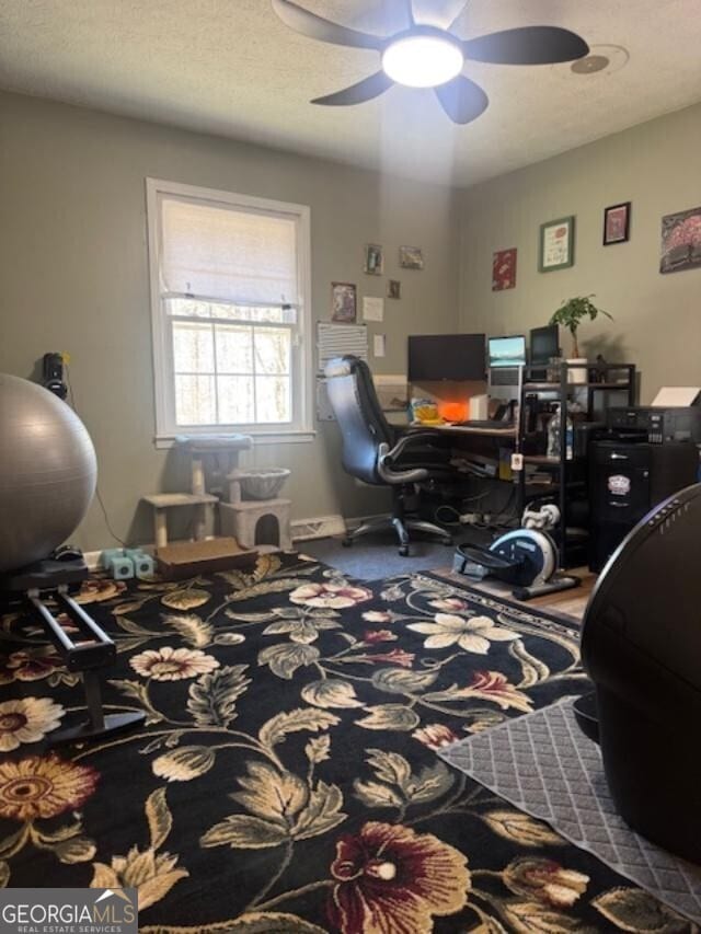 office featuring a textured ceiling and ceiling fan