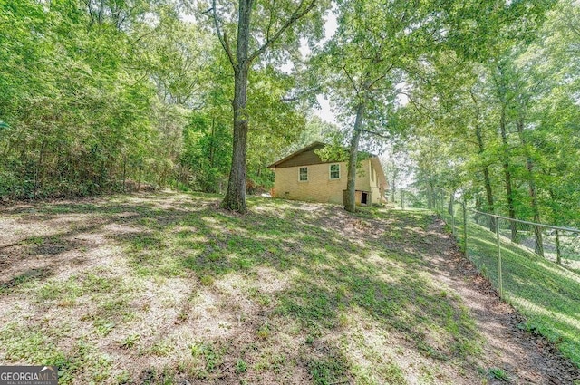 3209 Wax Rd SE, Aragon, GA 30104 - view of yard with a forest view and fence