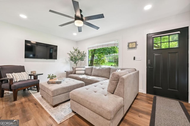 living room featuring a ceiling fan, recessed lighting, and wood finished floors