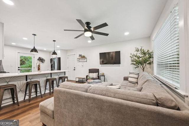 living room featuring recessed lighting, wood finished floors, and ceiling fan