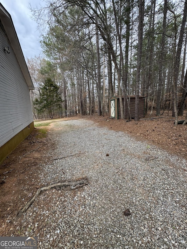 view of yard with a shed and an outdoor structure