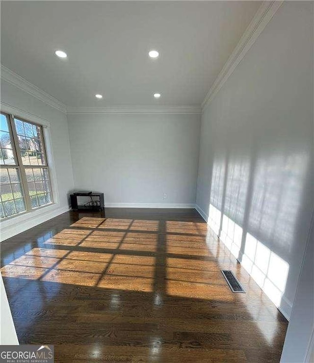 empty room with ornamental molding, recessed lighting, and visible vents