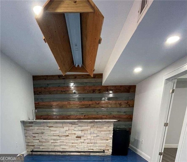 bar featuring wood walls and visible vents