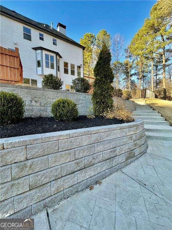 exterior space with a chimney and fence