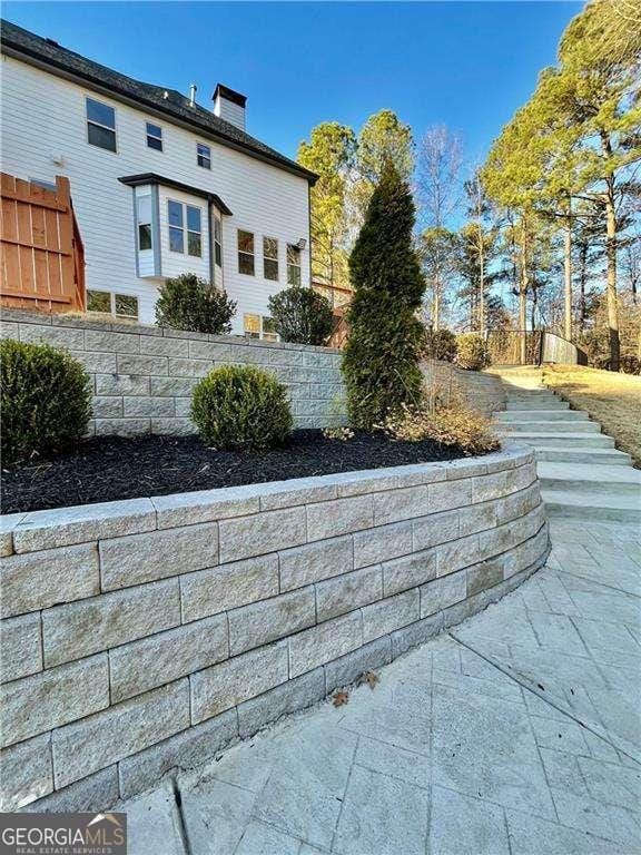 3499 Lake Mill Rd, Buford, GA 30519 - view of home's exterior with a chimney