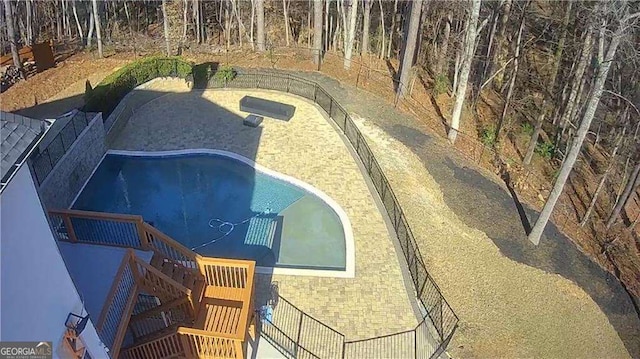 view of pool featuring stairs and a fenced in pool