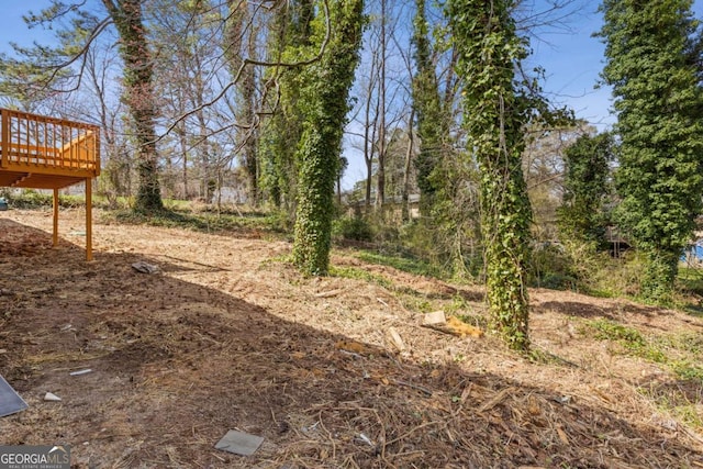 view of yard with a wooden deck