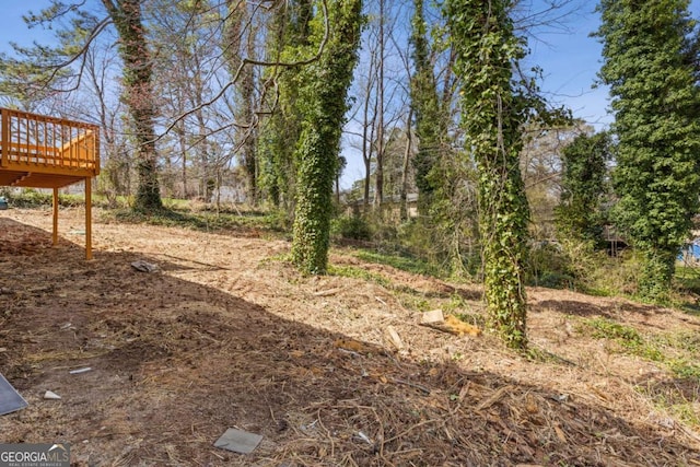 5277 Cardinal Ln NW, Lilburn, GA 30047 - view of yard with a wooden deck