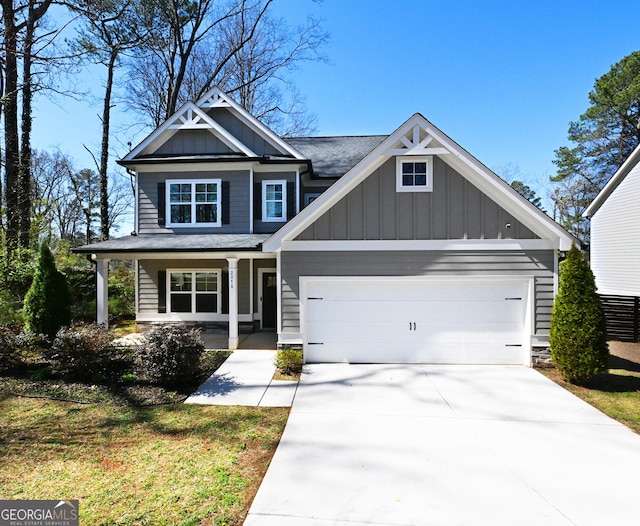 craftsman house featuring driveway, a porch, board and batten siding, an attached garage, and a shingled roof