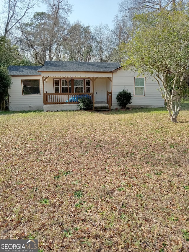 ranch-style house with crawl space, covered porch, and a front yard