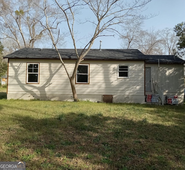 view of home's exterior featuring a yard