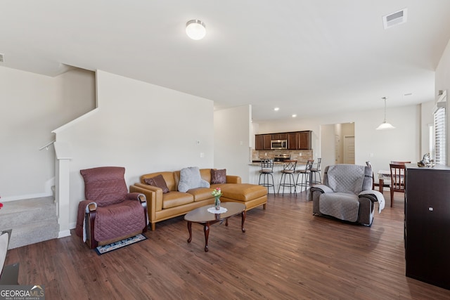 living area with visible vents, baseboards, stairway, recessed lighting, and dark wood-style flooring