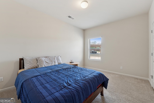 bedroom with visible vents, baseboards, and carpet flooring