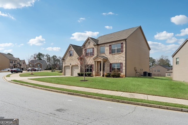 traditional-style house with a front lawn, central air condition unit, brick siding, and driveway