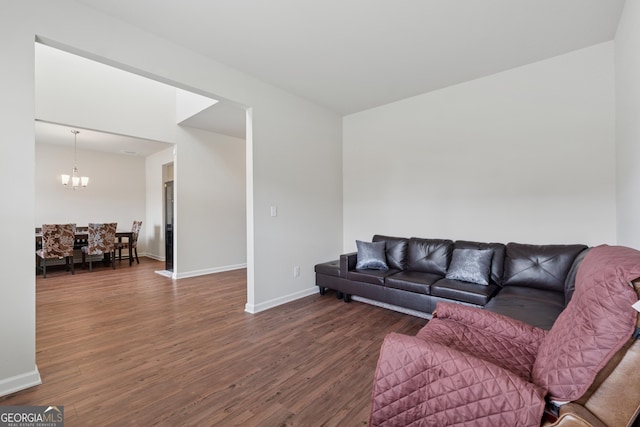 3243 Shoals Park Dr, Decatur, GA 30034 - living room featuring dark wood-type flooring, baseboards, and a chandelier
