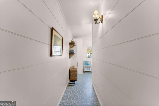 corridor featuring vaulted ceiling