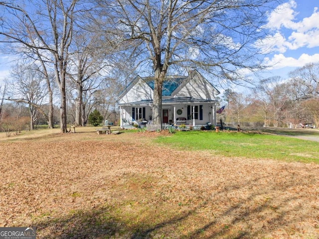 view of front of home with a front lawn and a porch